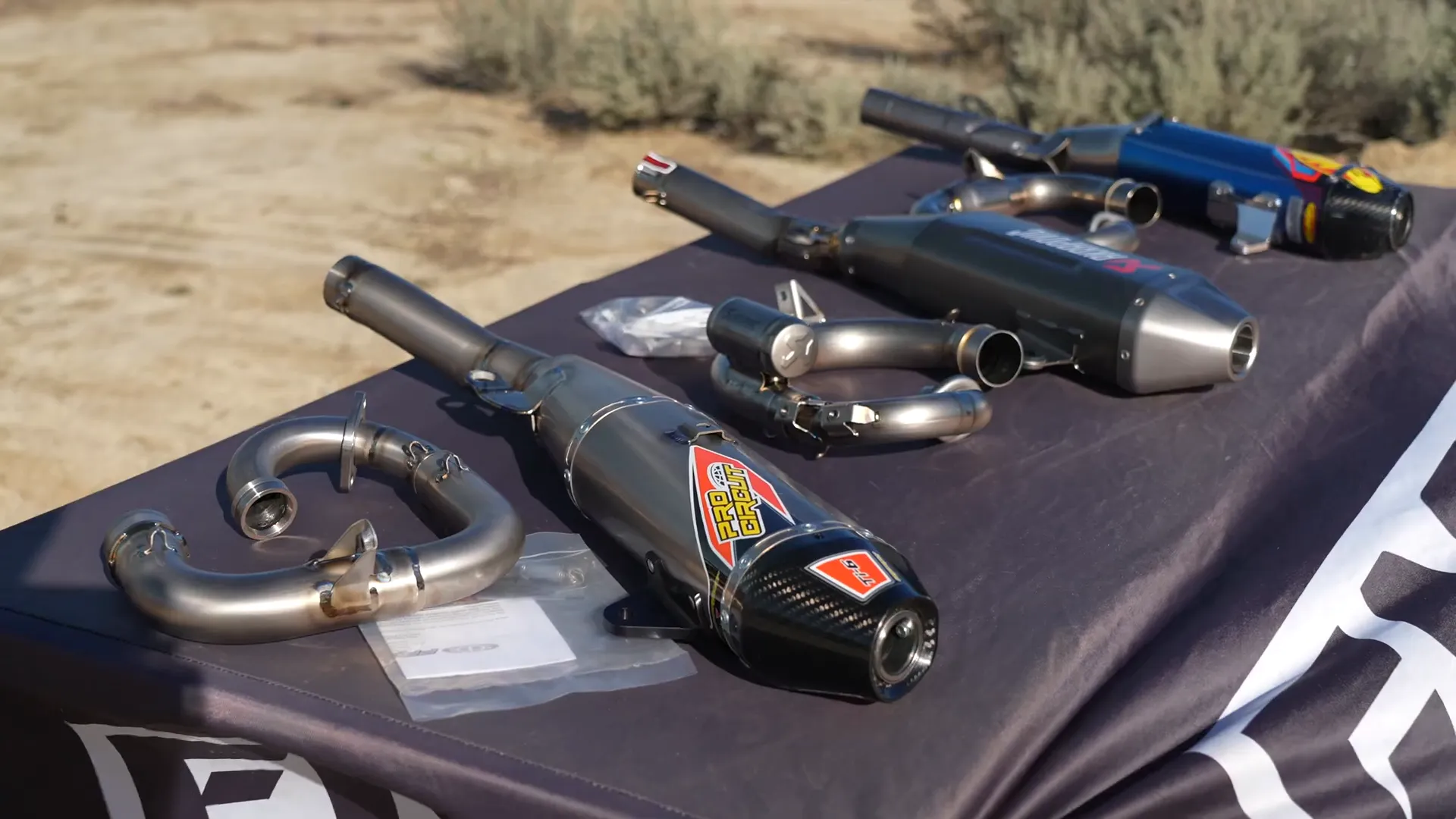 Rider testing different titanium exhausts on Yamaha YZ250F at Kuya Creek Motocross
