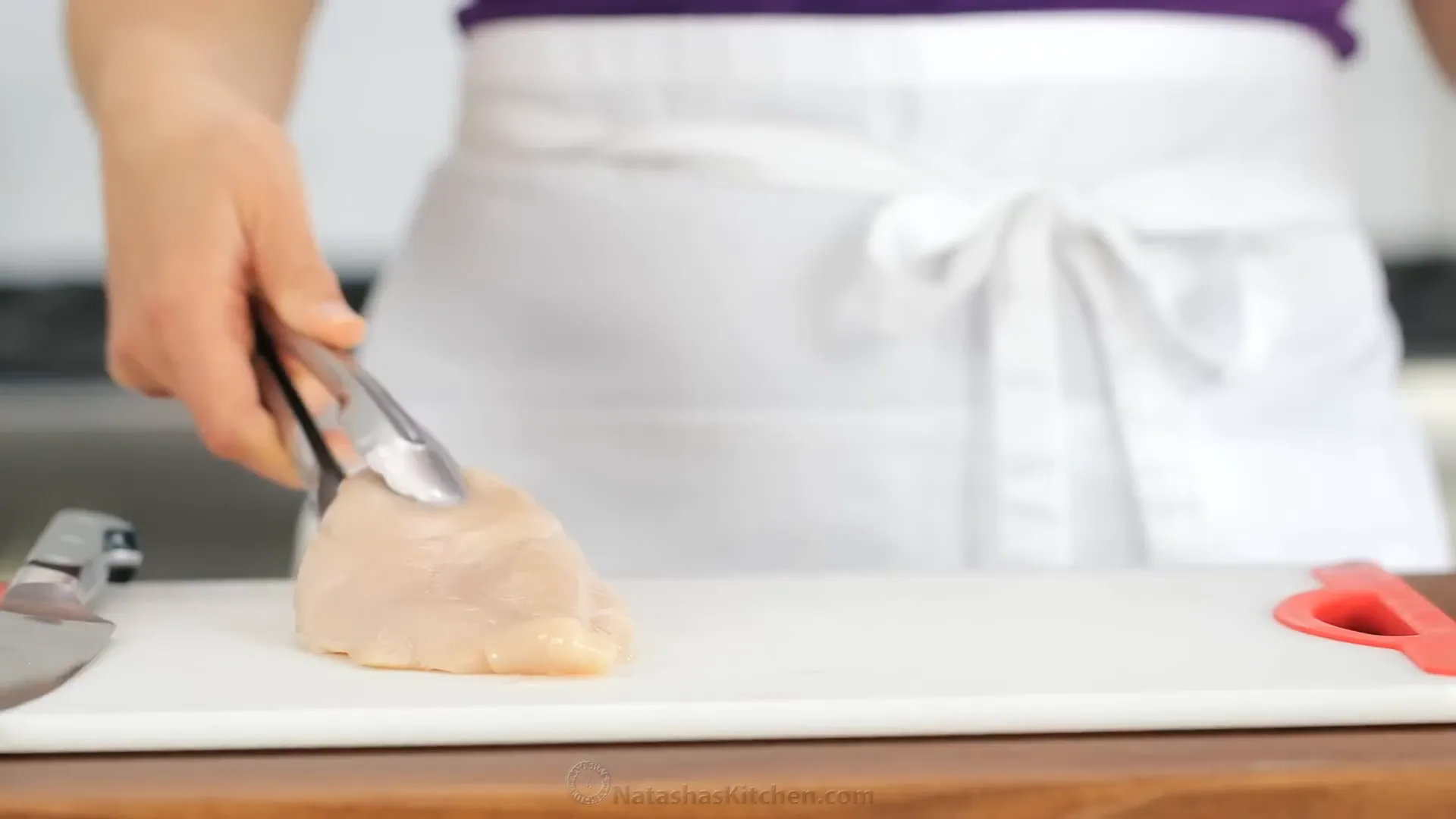 Cutting chicken breasts