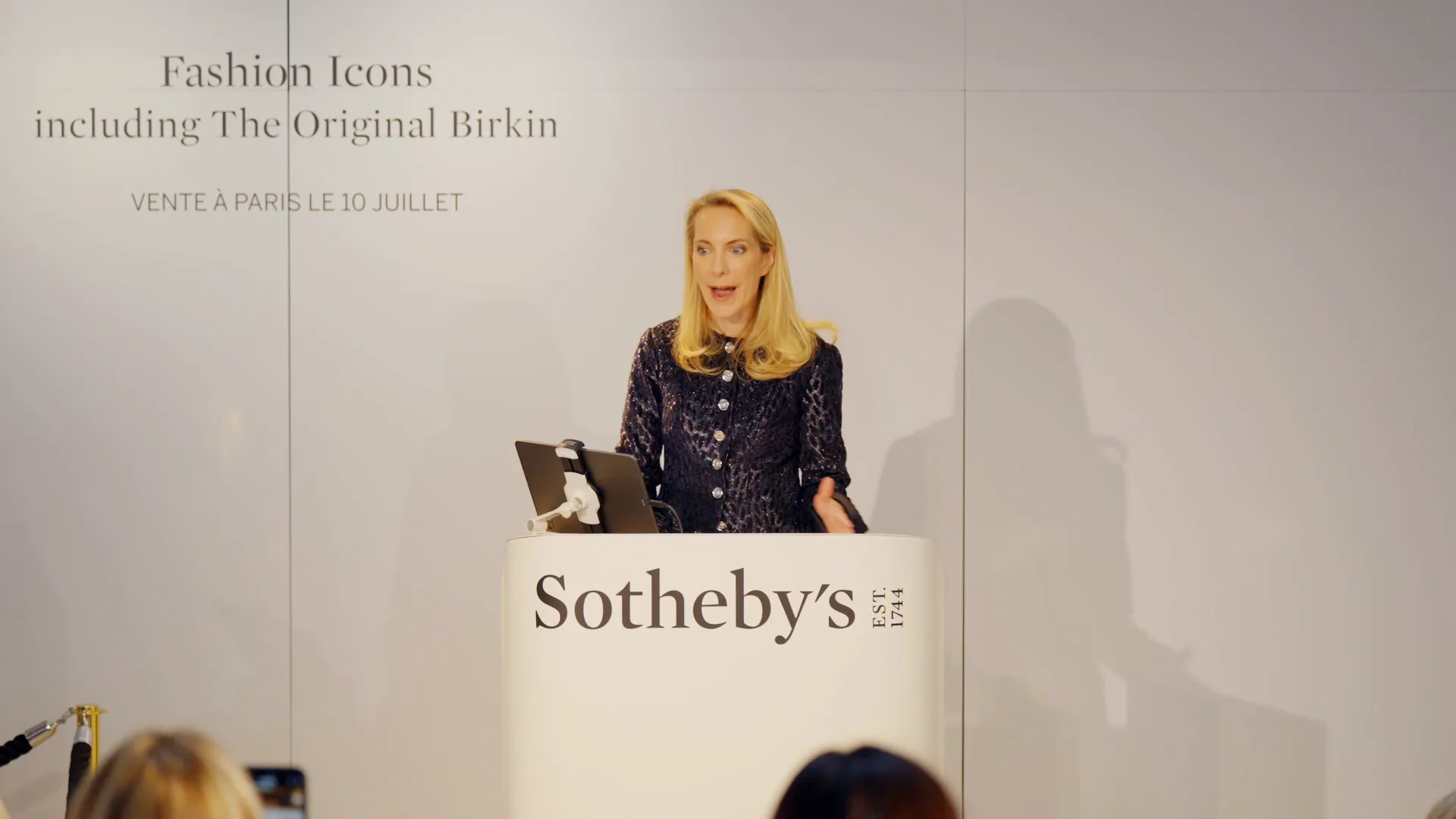 Auctioneer announcing the start of the bidding at one million euros
