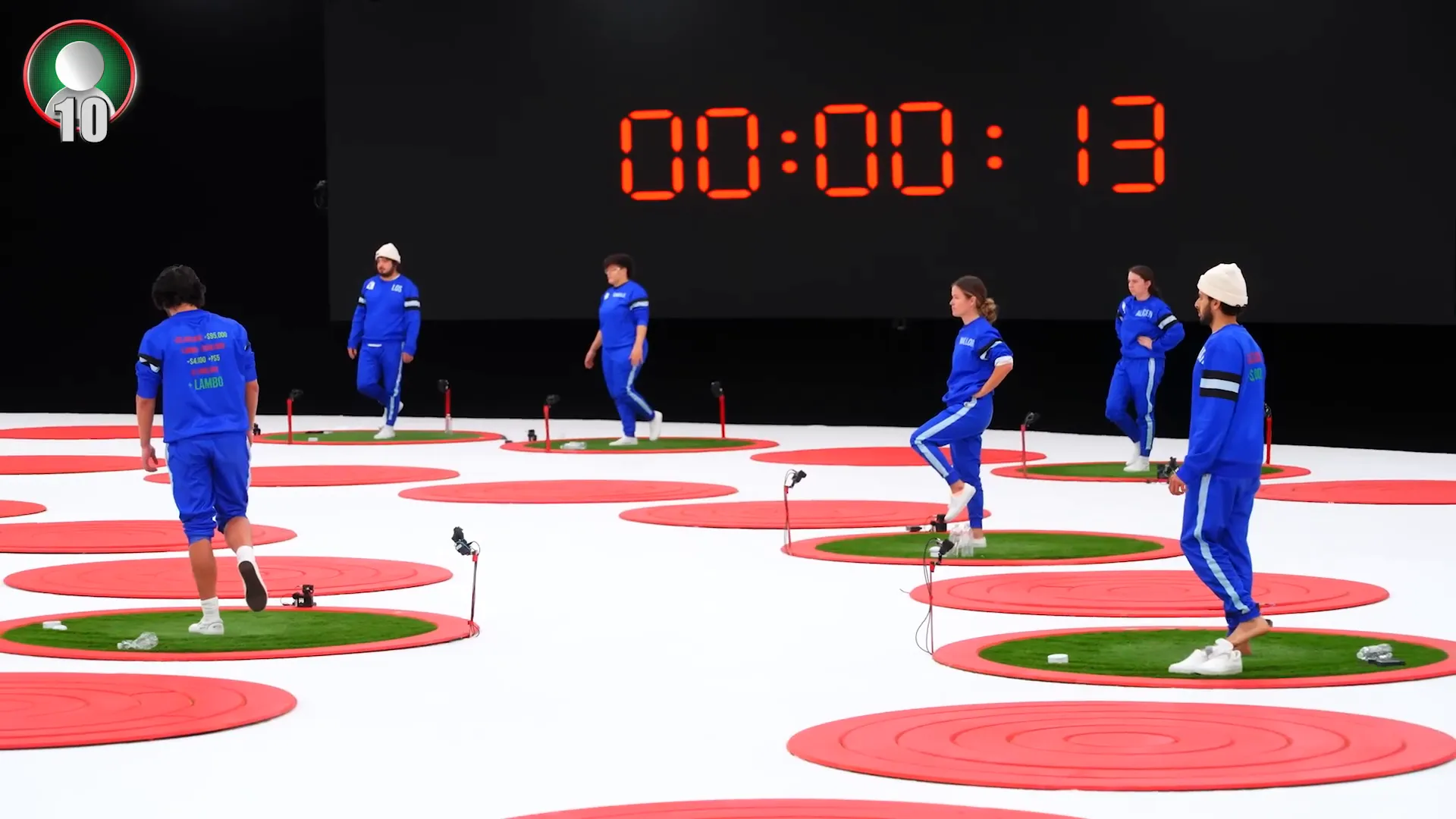 Contestants balancing on one leg, showing focus and determination