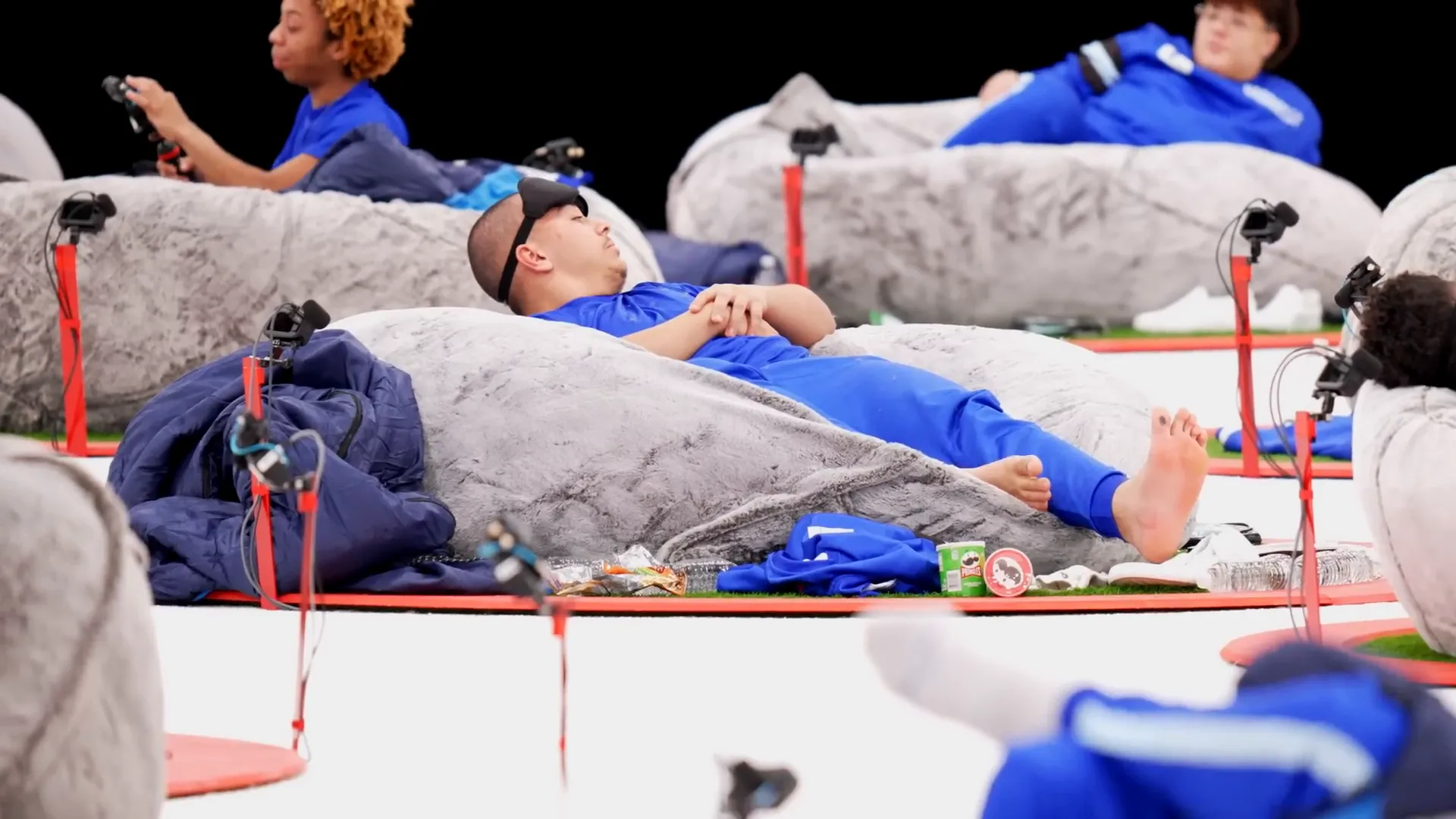 Contestants trying to stay awake inside their circles