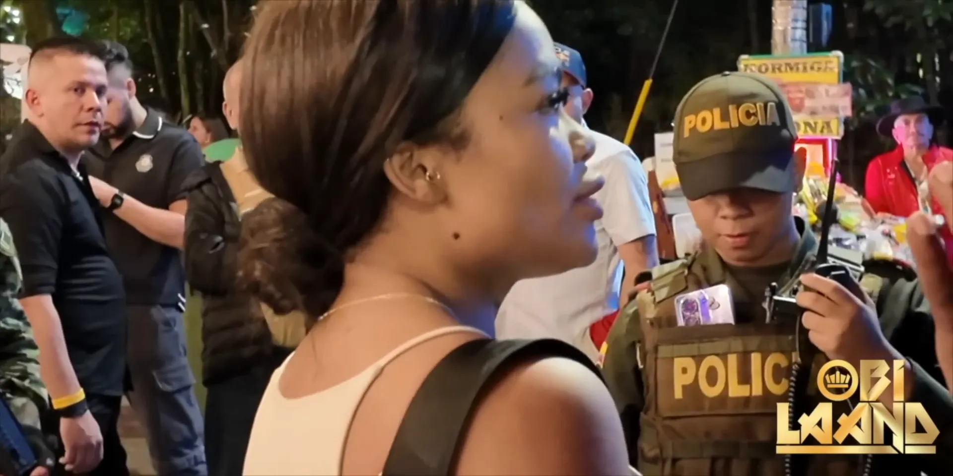 Maria protesting innocence to police officers