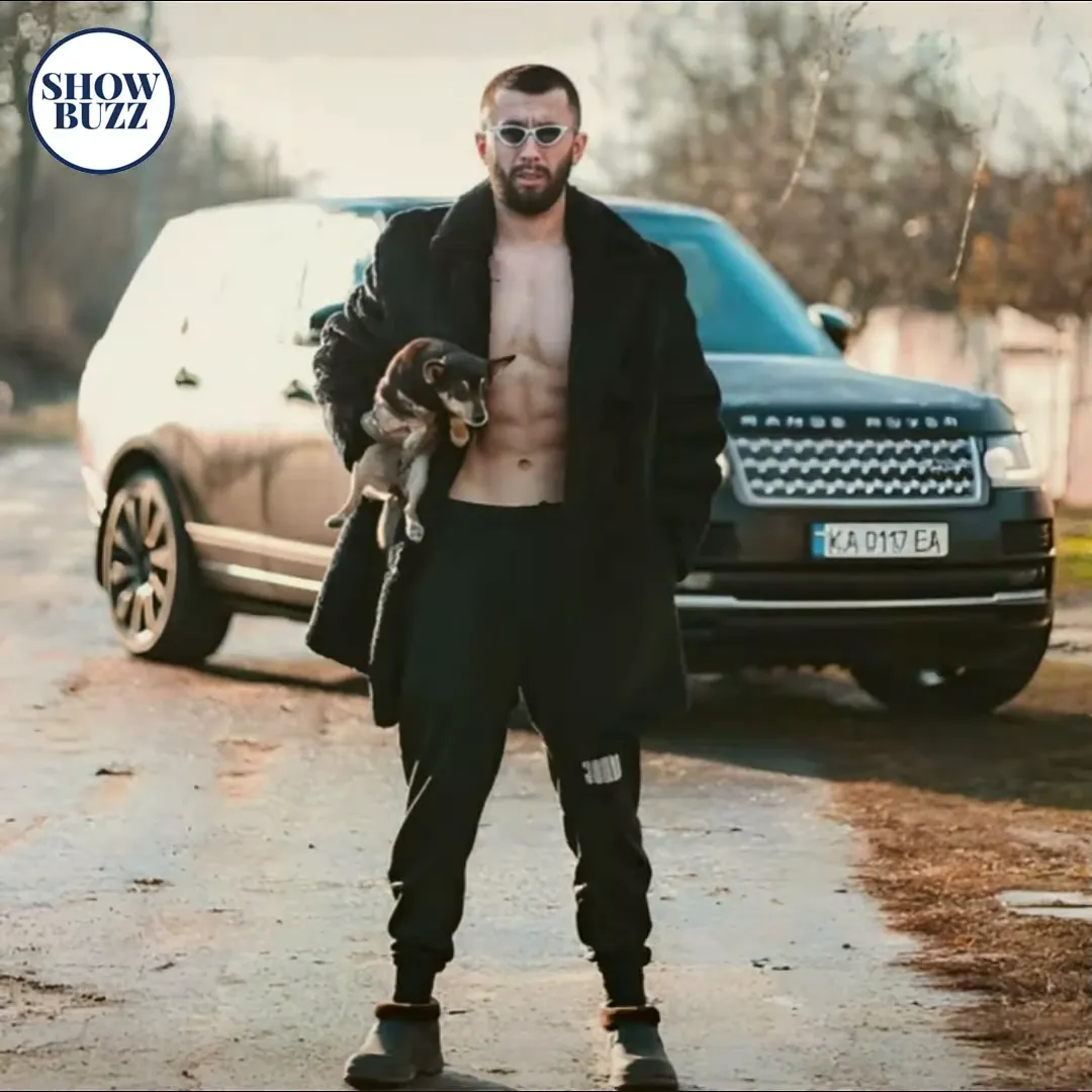 Vladimir posing with his car collection