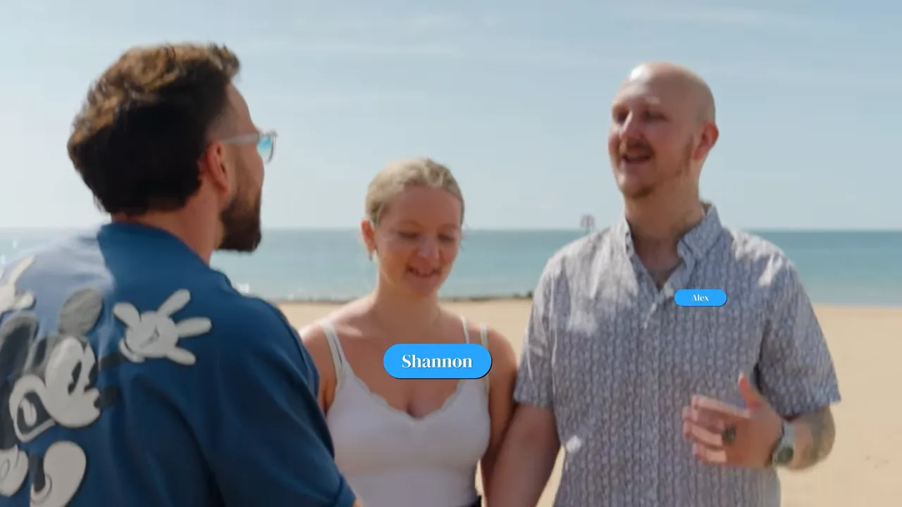 Host greeting two contestants on the beach with name-label overlays visible on screen.