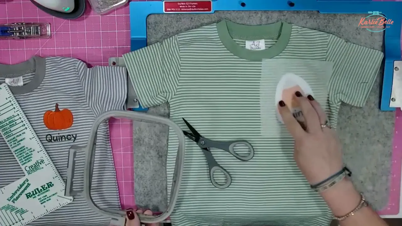 Ironing fusible no show poly mesh on inside of shirt embroider names with a machine