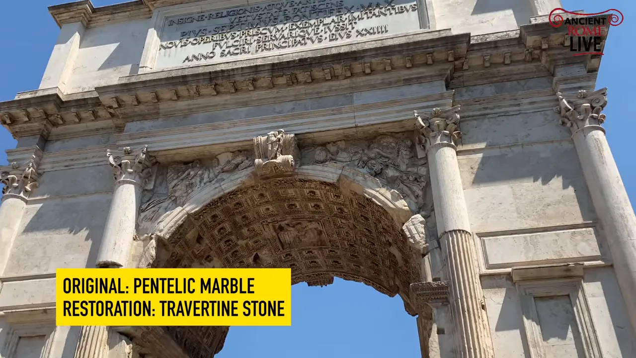 Upward view of the Arch of Titus showing pale reconstruction stone and carved original interior