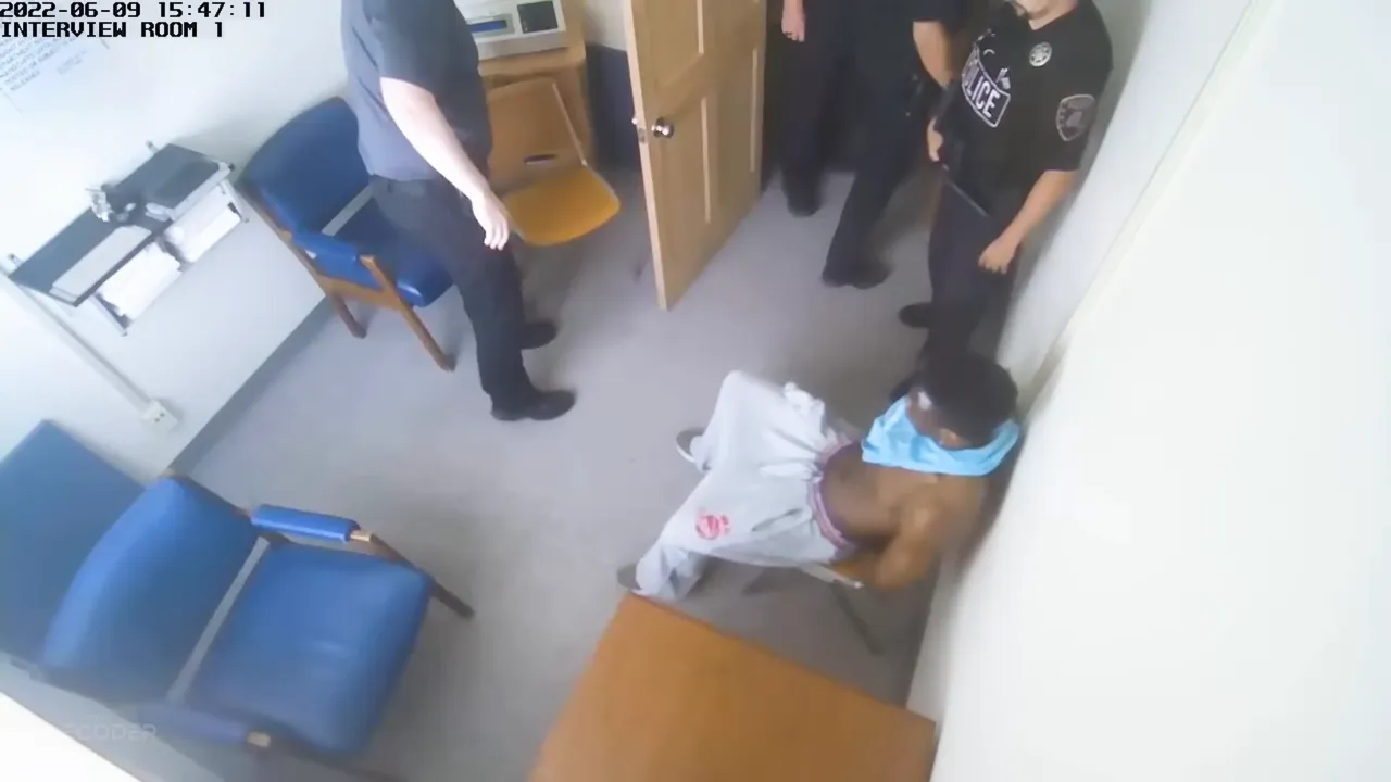 Still from the arrest footage showing DeAndre being taken into custody by law enforcement