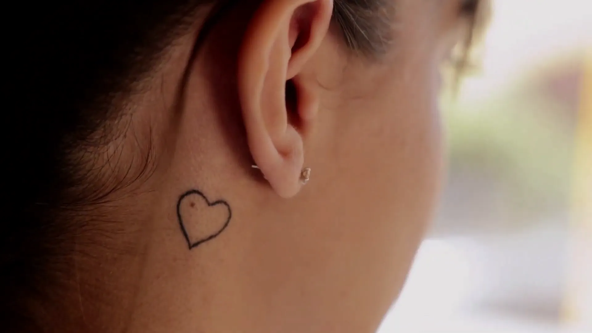 Tiny heart tattoo