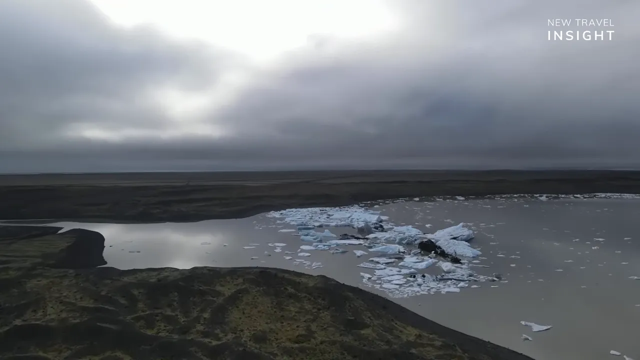 Wide view of Vatnajökull glacier ice chunks floating in glacial lagoon in Iceland