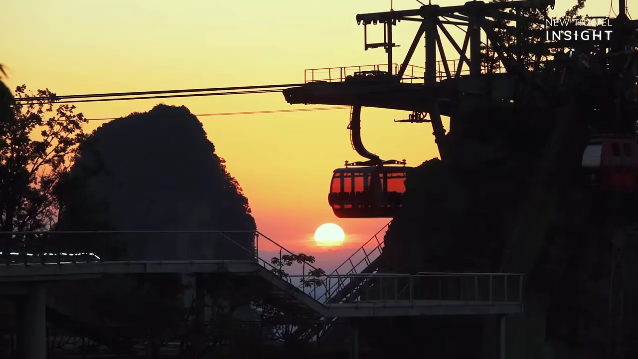 Cable car approaching a mountainous station at sunset at Tianmen Mountain, China