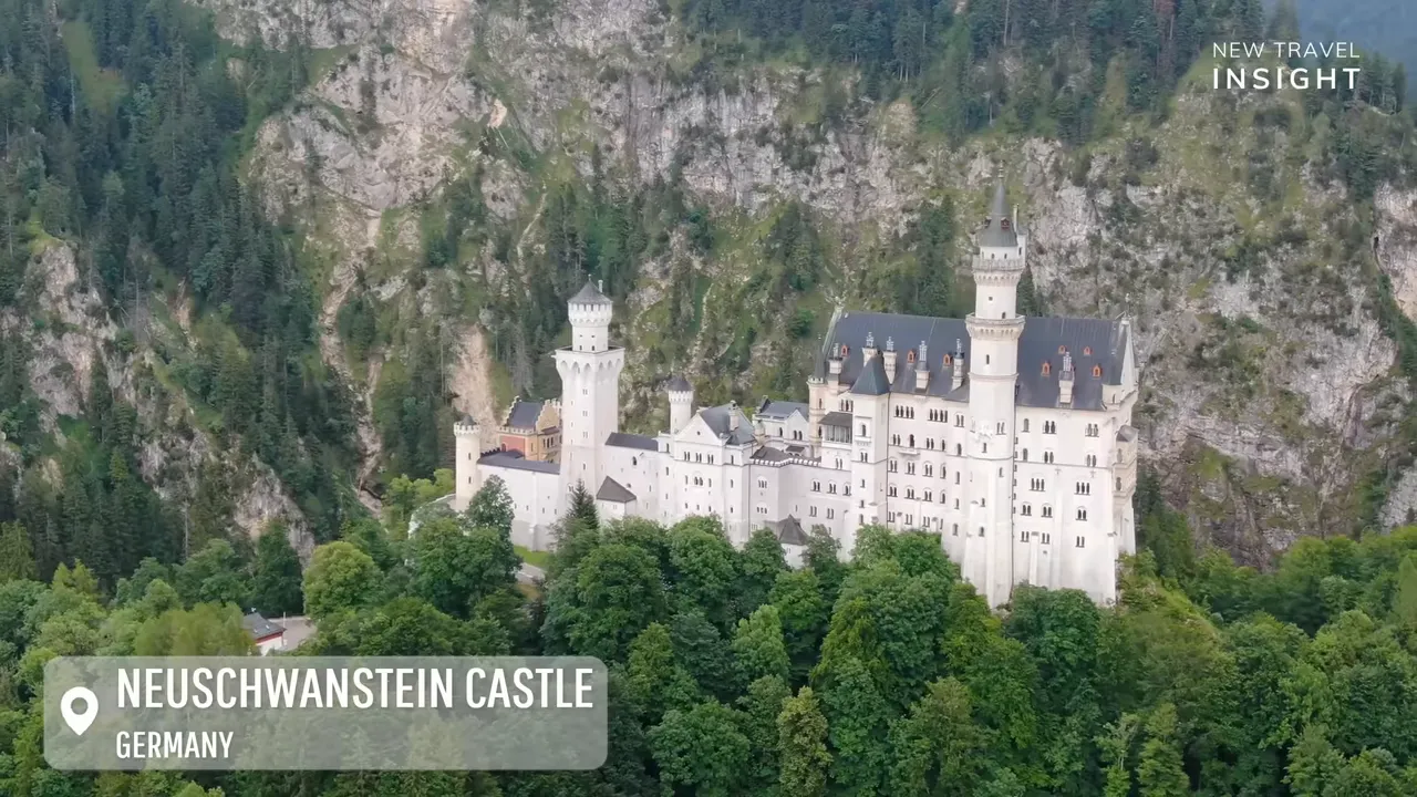 Neuschwanstein Castle viewed from above with towers and surrounding mountains in Bavaria, Germany