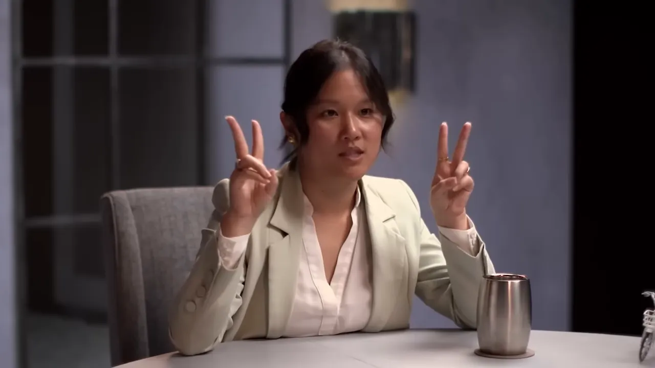 Karen Hao with hand gestures during interview about AI power concentration