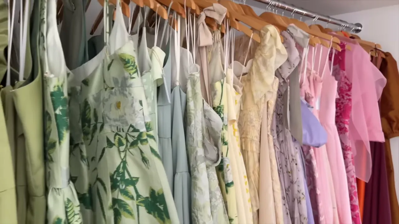 Close view of pastel bridesmaid dresses hanging on a showroom rack