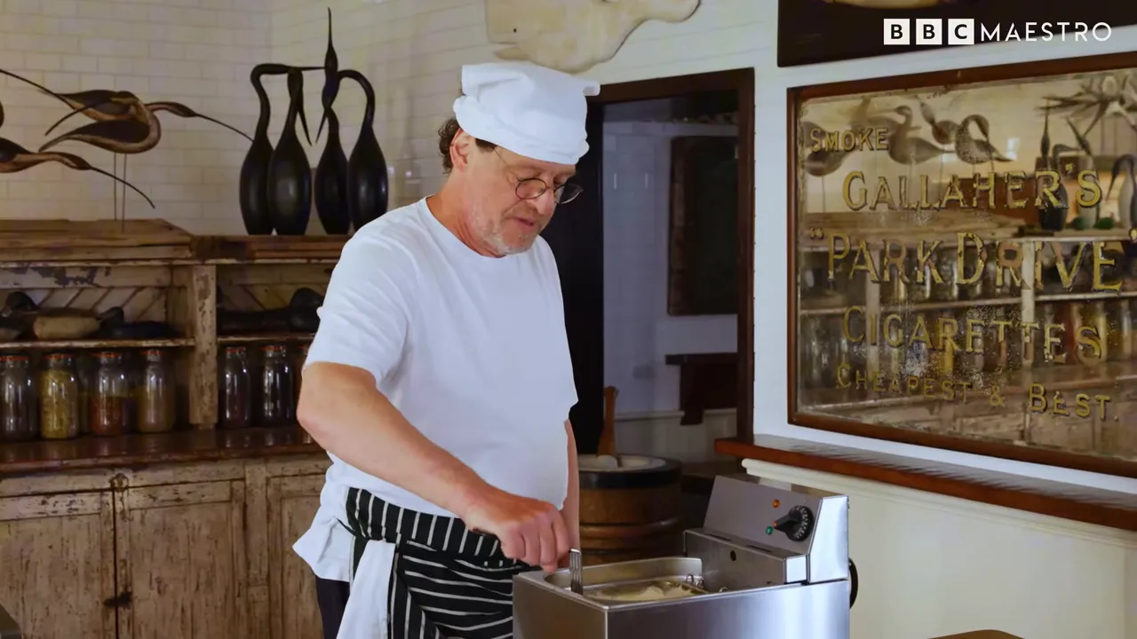 Chef Marco Pierre White finishing twice-cooked chips with a buttered flourish