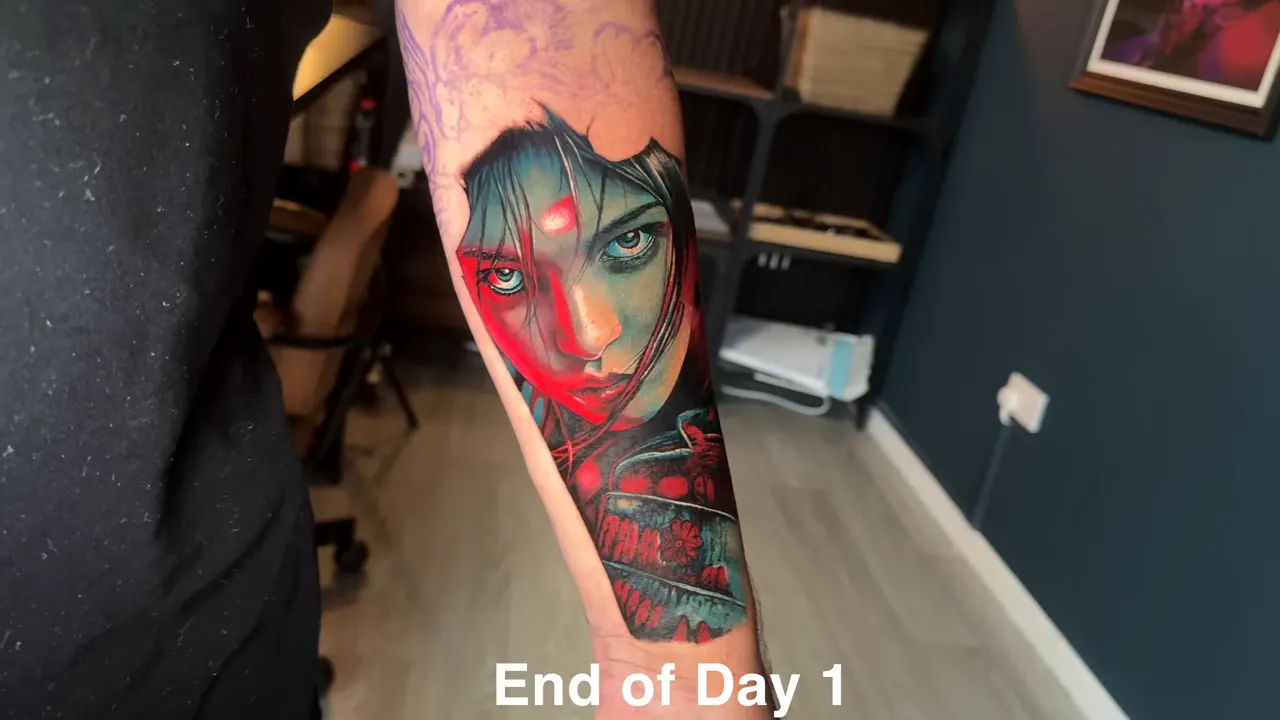 Finished forearm tattoo at end of day one showing female samurai portrait and sword