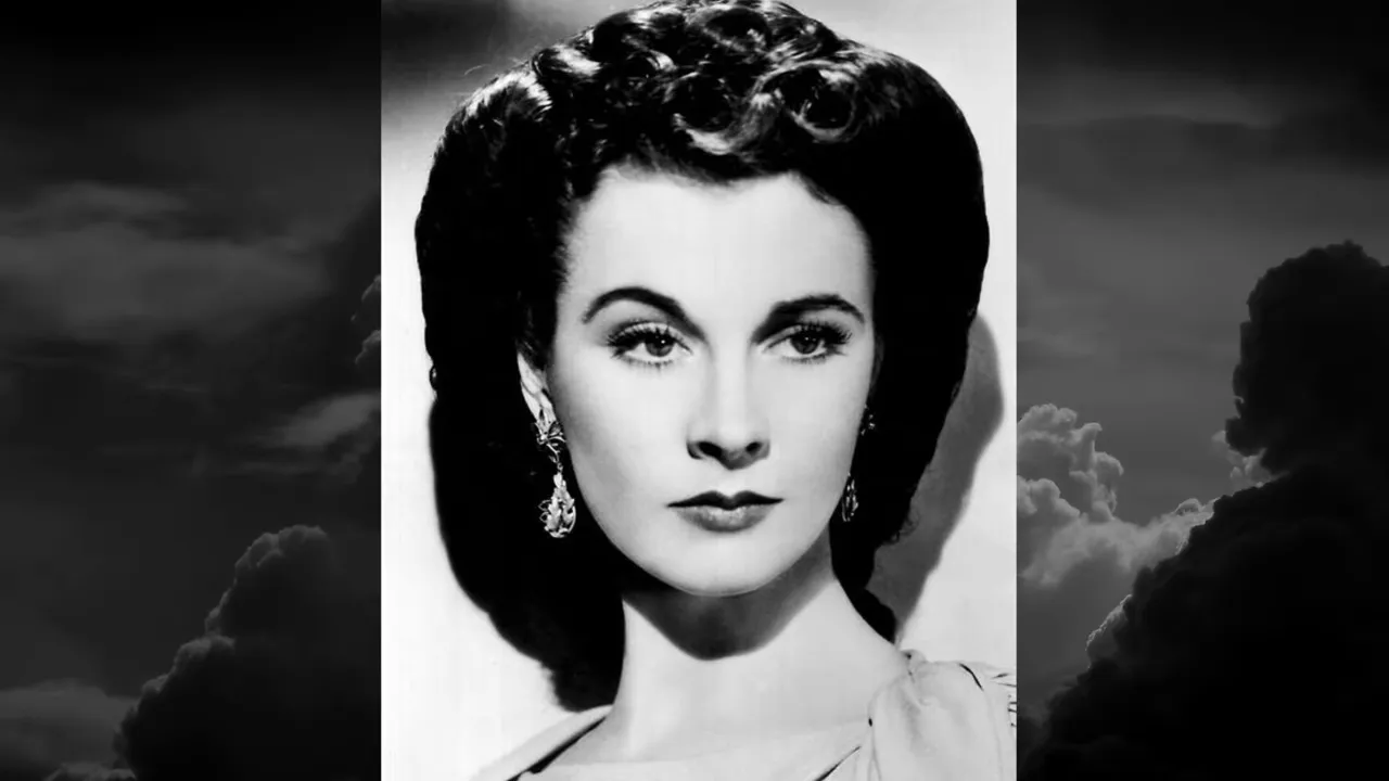 Black-and-white studio portrait of a woman in 1940s style, clear face, neutral expression.