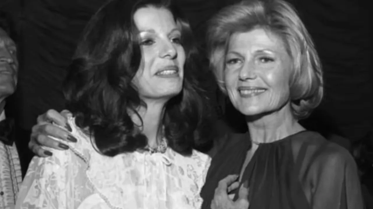 Black and white photograph of Rita Hayworth standing closely with her daughter Yasmin Aga Khan