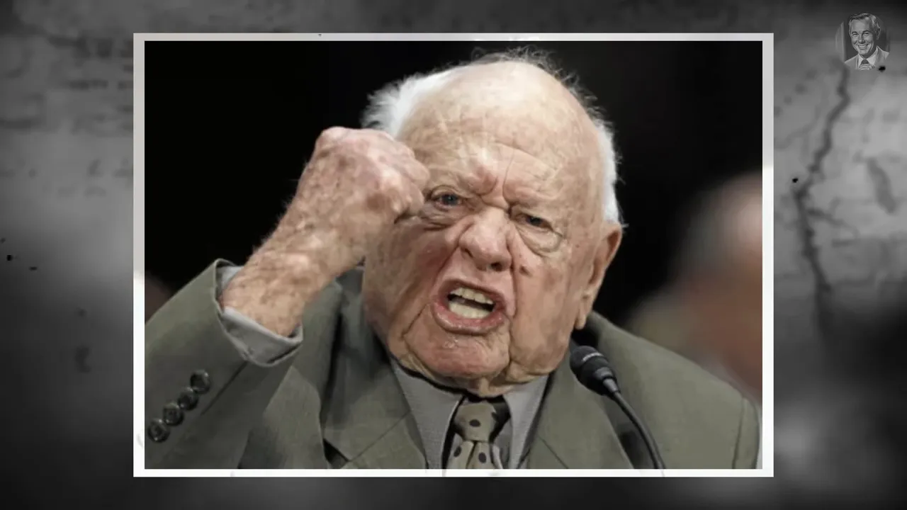 Crisp image of an elderly man speaking emphatically into a microphone with a raised fist at a hearing