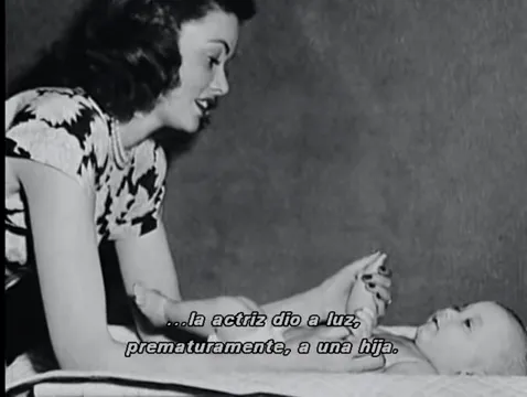Gene Tierney with her newborn daughter, Daria