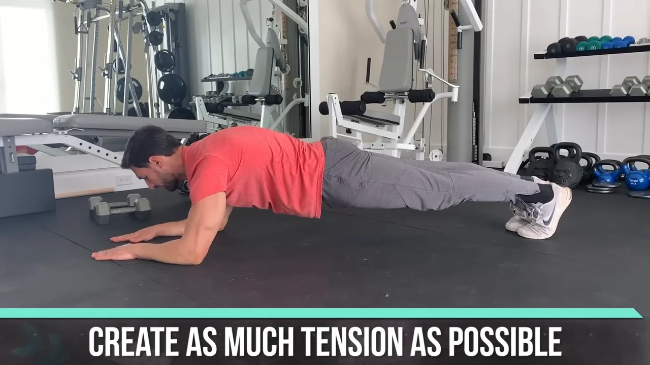 Trainer holding a forearm plank with text reading create as much tension as possible
