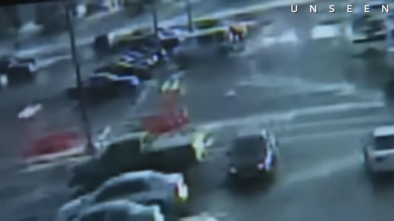 Surveillance video still showing the suspect's Jeep Cherokee in the Home Depot parking lot