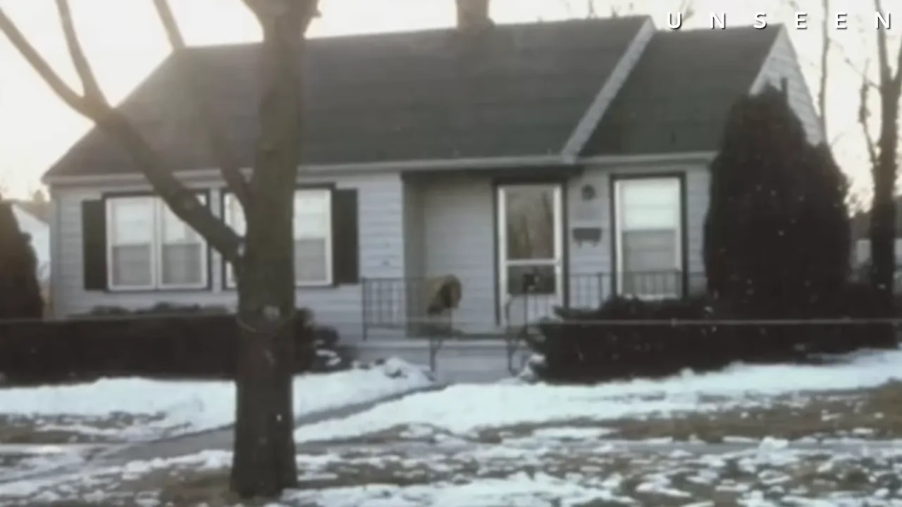 Back gate and snowy driveway at the Otero home