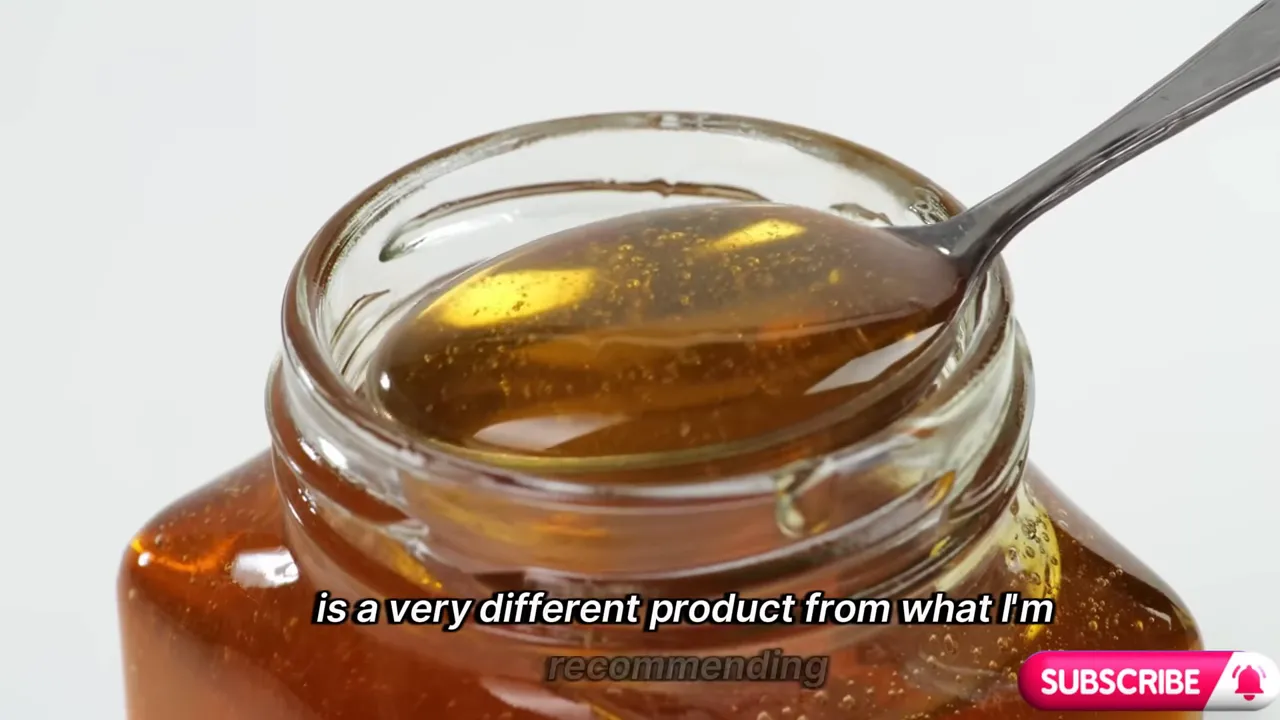 Spoon resting in a jar of raw honey