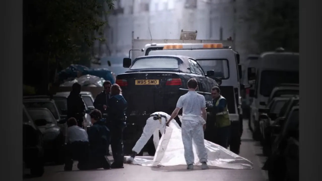 Crowds, paramedics and members of the public near the crime scene moments after the killing