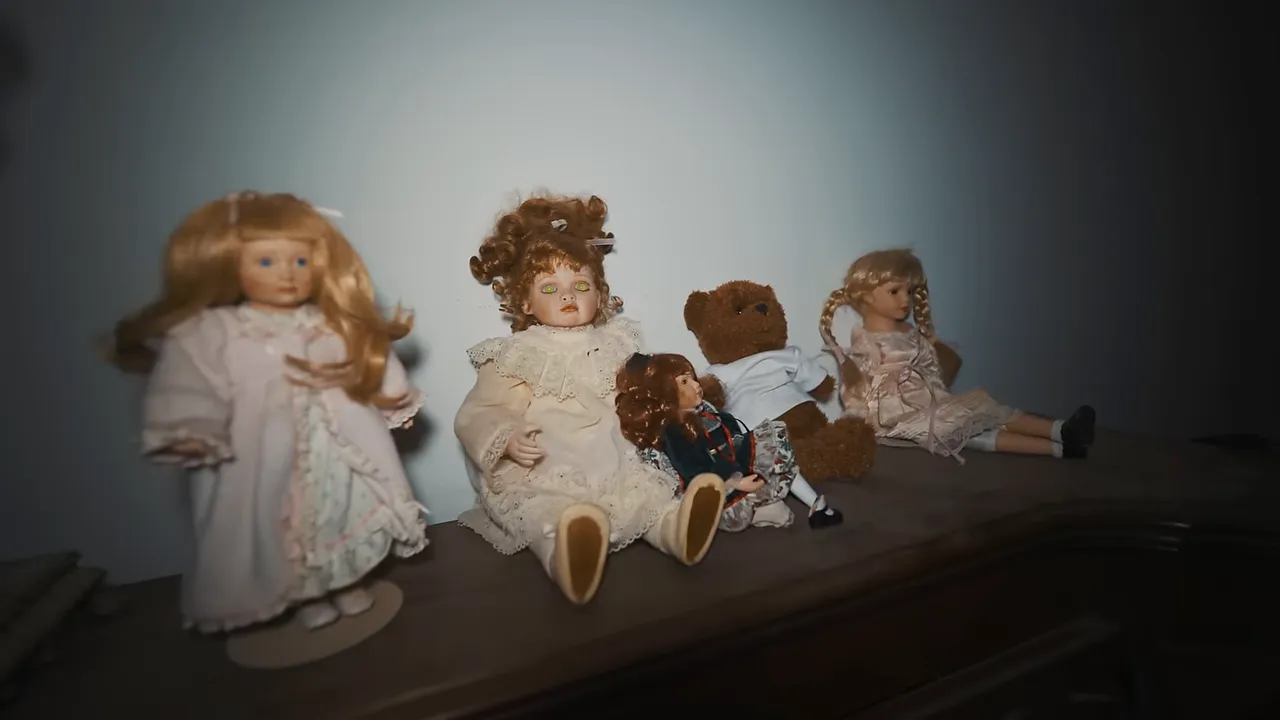 Creepy dolls arranged on an old organ on the third floor, adding to the eerie atmosphere