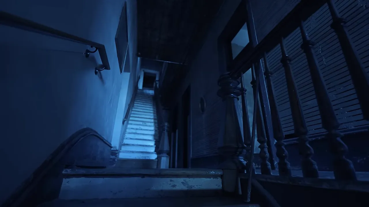 Corridor on the second floor with old wallpaper and long hallway suggesting children's laughter could echo