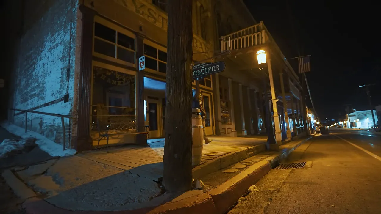 Empty main street in Virginia City at dusk, evoking the feeling of a literal ghost town