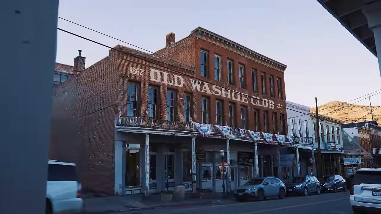 Exterior shot of the Washoe Club entrance with saloon doors and old signage