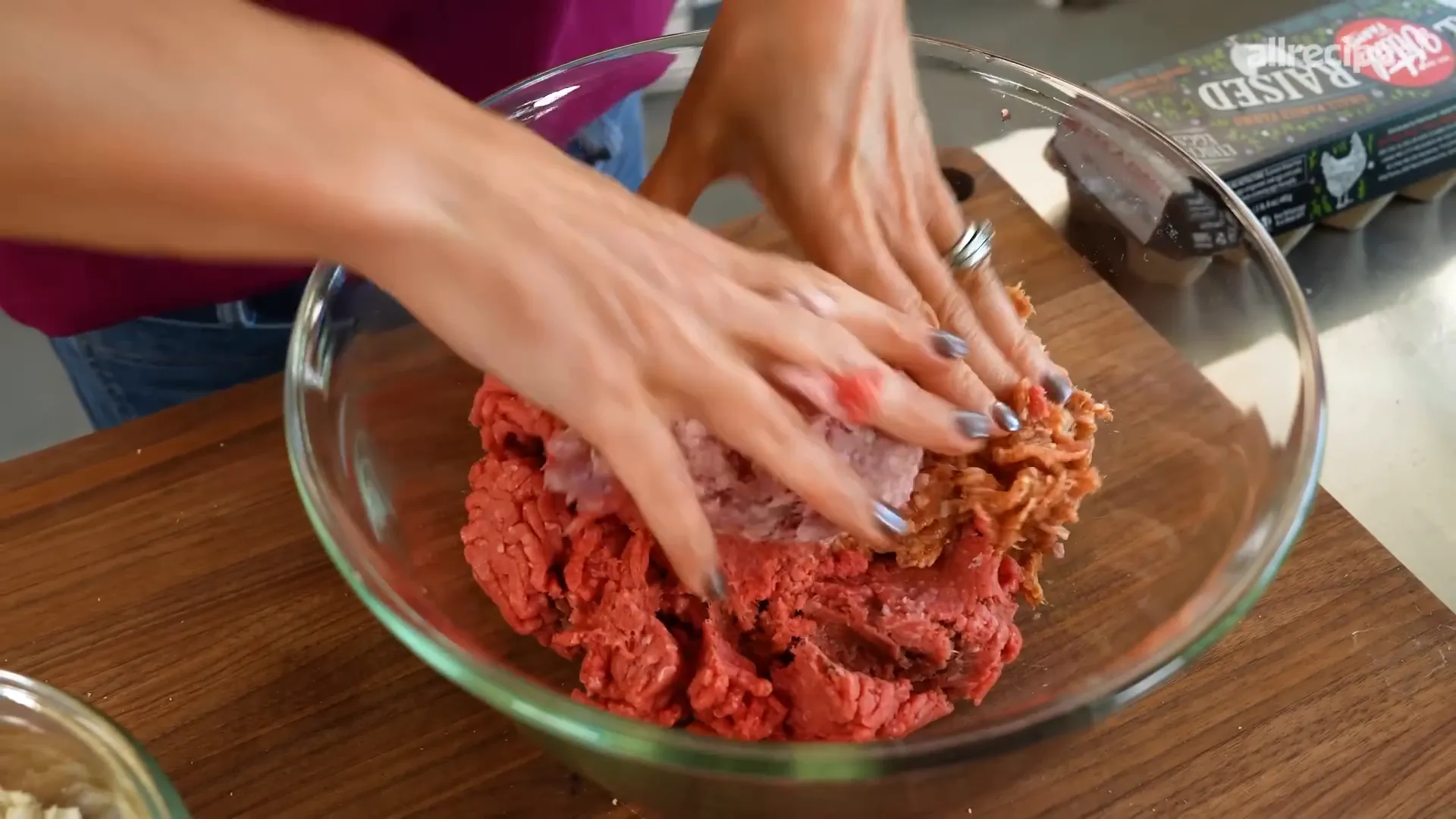 Mixing Rao’s famous meatball ingredients