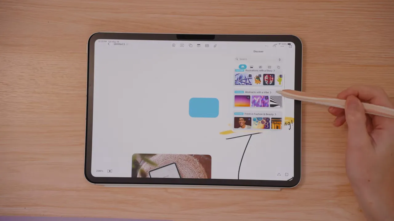 iPad Freeform showing asset categories in Creator Studio and hand using Apple Pencil