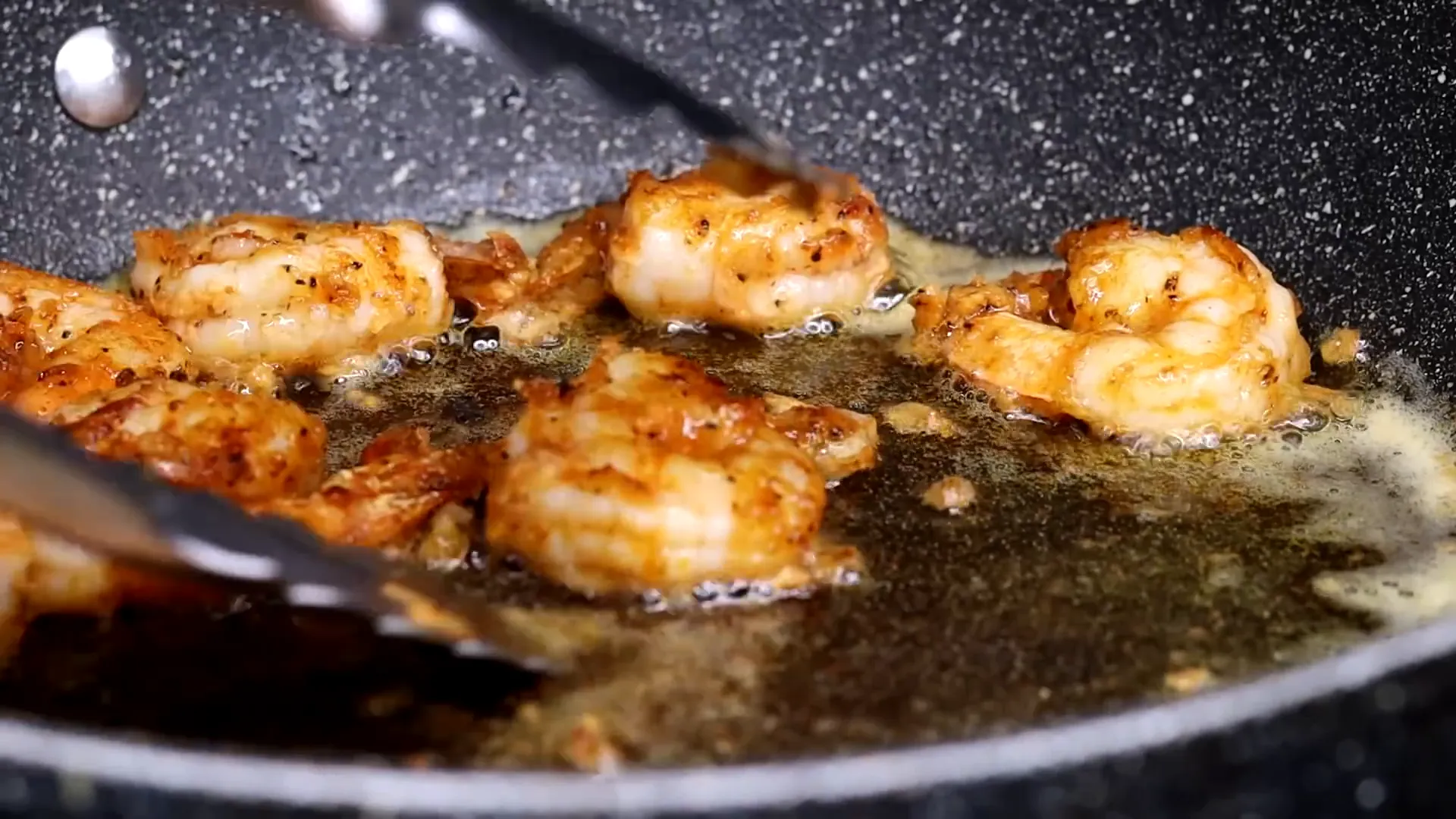 Removing cooked shrimp from skillet