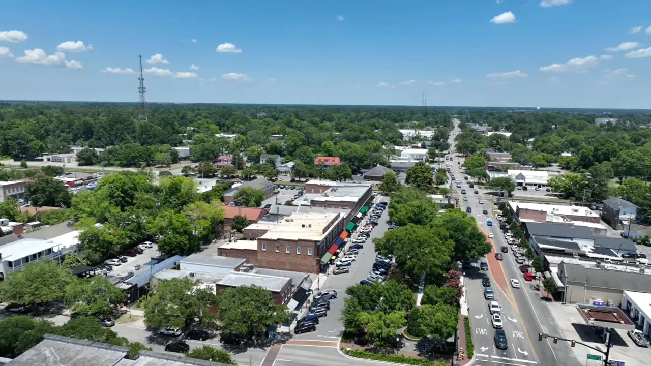 Aerial view of Summerville SC downtown area with roads, parking lots, and surrounding neighborhoods