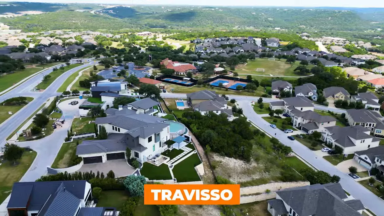Aerial view of Travisso master-planned community showing homes, pools, parks and streets