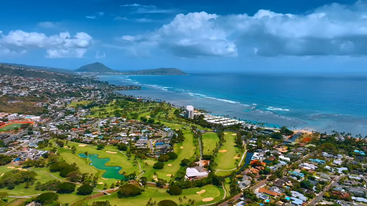 Aerial coastline and neighborhood view in Hawaii showing the island environment for real estate