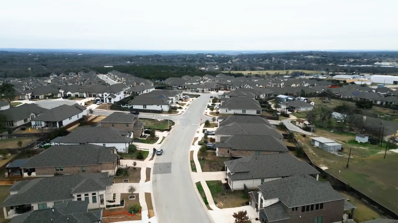 Aerial overview of residential streets in western Buda, Texas
