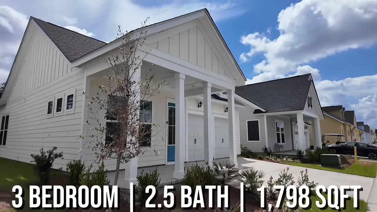 Single-story white home with front porch and attached garage