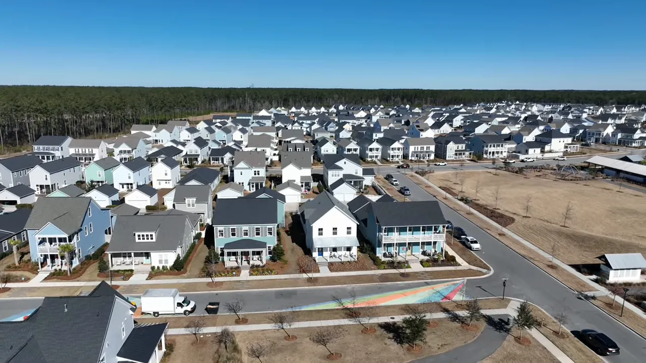 Aerial view of neighborhood streets and homes under construction