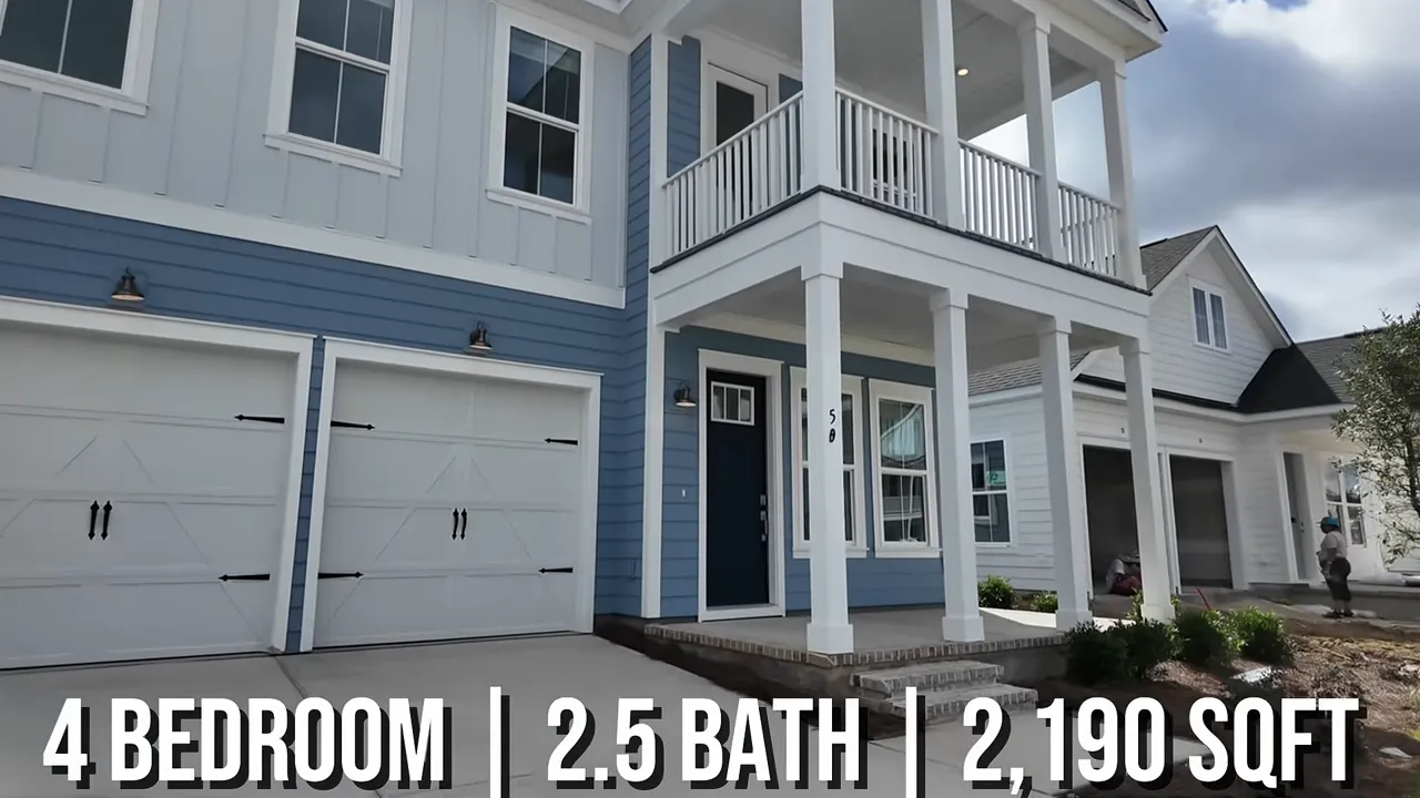 Two-story white home with double front porches and attached garage