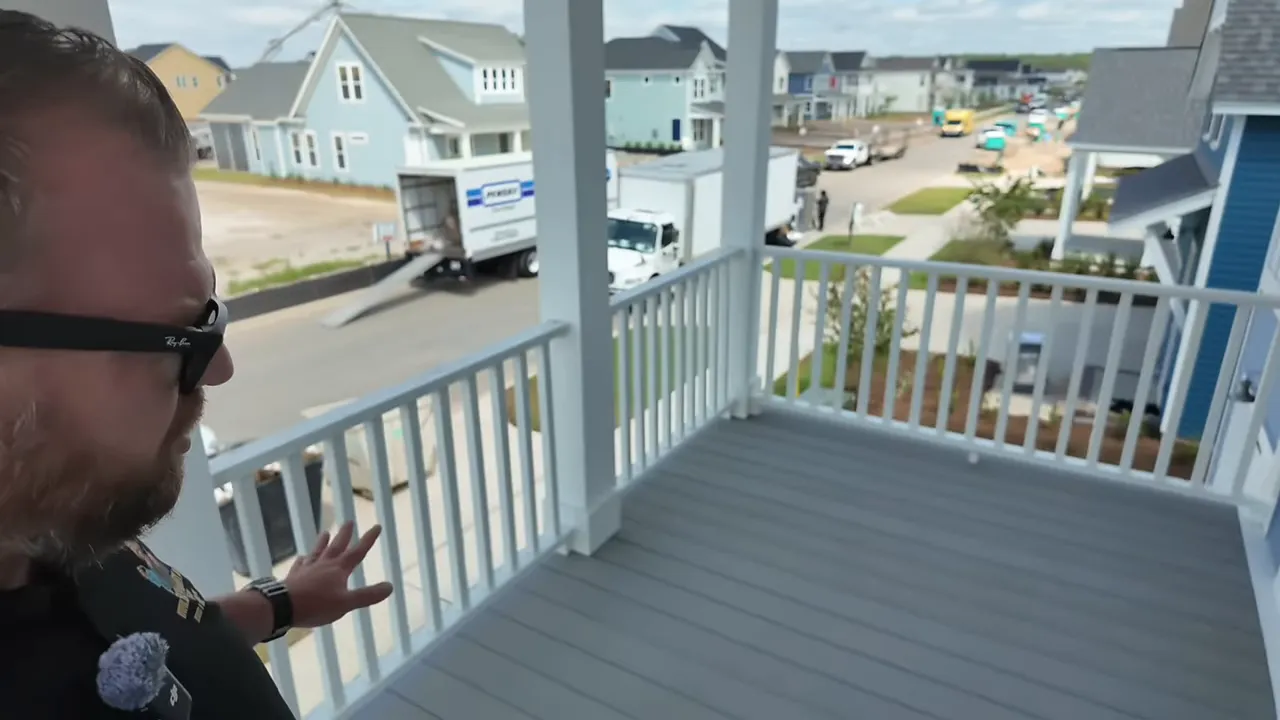 Second-story porch with gray composite decking and white railings