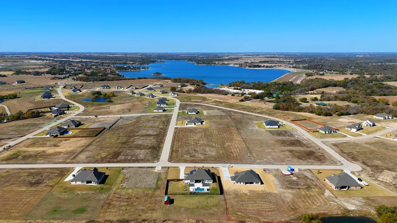 Aerial view of Lakeway Estates neighborhood with large lots and Lake Waxahachie in the distance