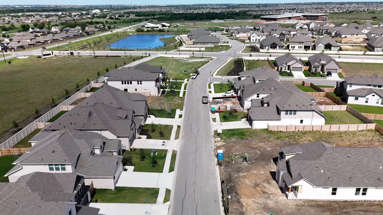Aerial neighborhood view with text showing sales nearly doubled and 87 percent year over year