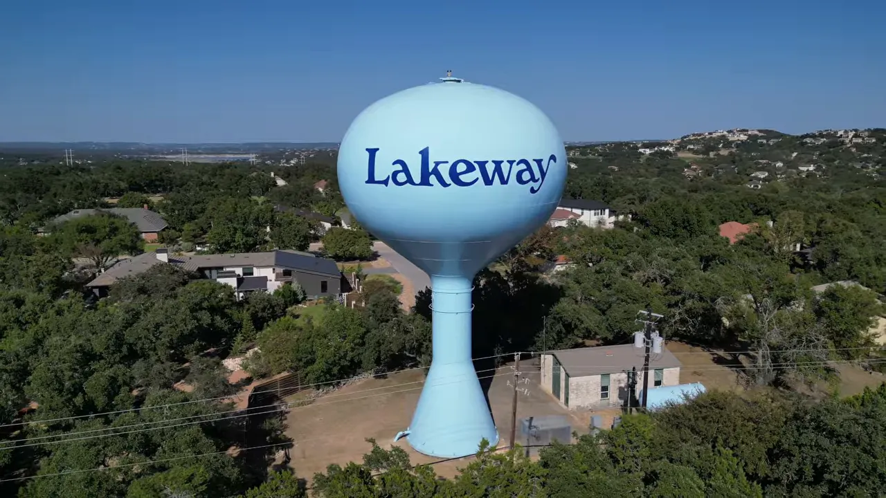 Lakeway water tower above trees and homes