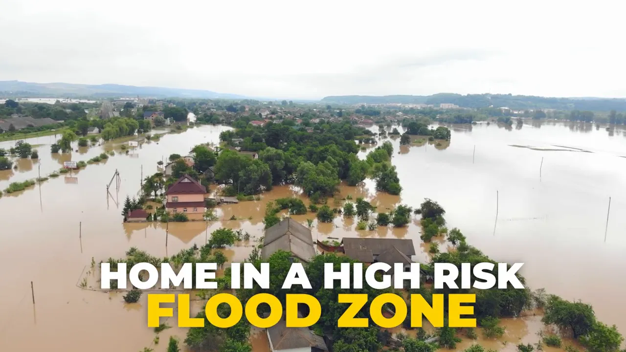 A flooded neighborhood with homes surrounded by high water in a high-risk flood zone