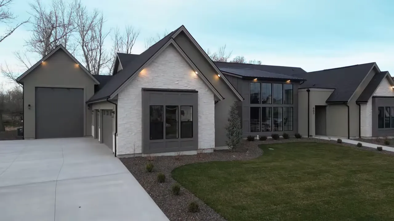 Modern farmhouse exterior with driveway and front windows in Middleton Idaho