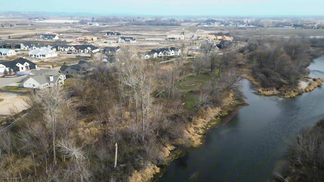 Aerial view showing riverfront homes and open space along the Boise River near Middleton, Idaho