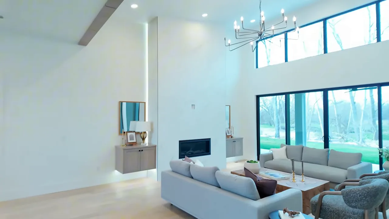 Bright open kitchen and living area with large windows in a Boise River home in Middleton Idaho